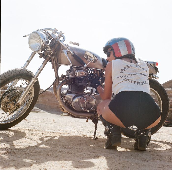 A playful frame from Girls on a motorcycle — online in Shenzhen